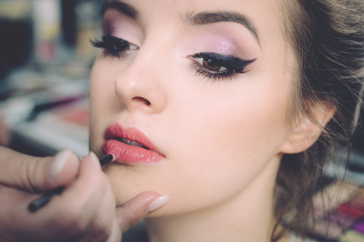 Close-up of a client's eye showing a full classic lash extension set and defined liner
